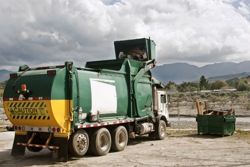 Construction site with waste materials being cleared in Fulham